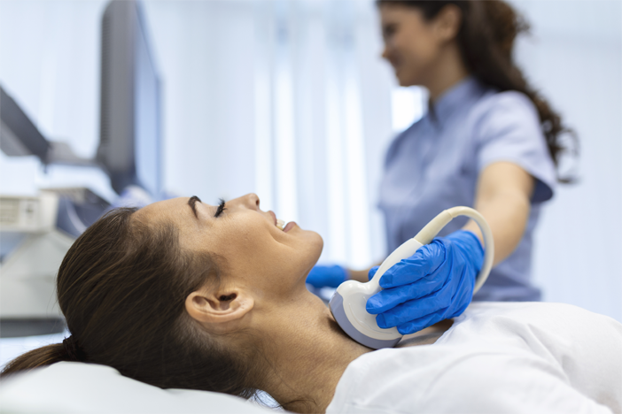 woman-patient-receives-thyroid-diagnostics-treatment-thyrotoxicosis-hypothyroidism-ultrasound-diagnostics-endocrine-system-thyroid